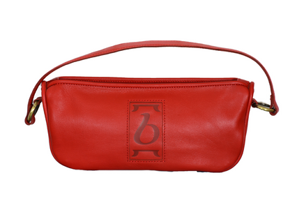 Red leather handbag with a logo on a white background